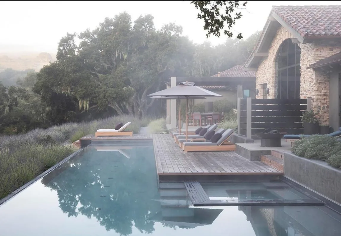 Carmel Contemporary Hacienda — the lap pool and ipe sun docks below the house in morning fog