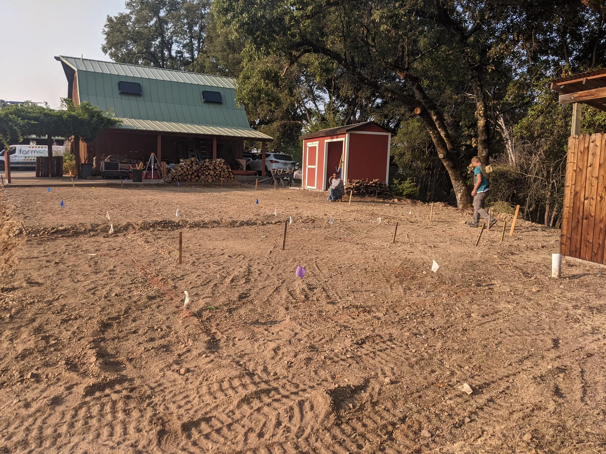 Before — the bare graded hillside pad as the project began